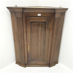 Georgian oak wall hanging corner cupboard, projecting cornice, single door enclosing three shelves, W80cm, H93cm, D44cm