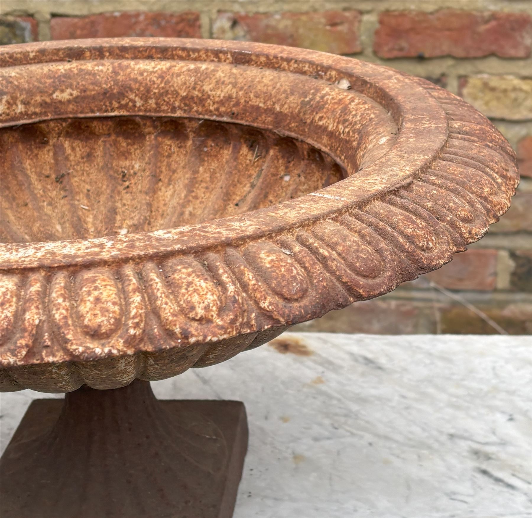 Victorian style cast iron garden urn, with egg and dart moulded rim above a reeded bowl and fluted socle. H27cm, D53cm - COLLECTION BY APPOINTMENT FROM: The White House, Thirsk Road, Easingwold, York, YO61 3NF - CALL 01723 507111 TO ARRANGE