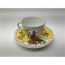 Dresden teacup and saucer, decorated with alternating panels of courting figures, and floral sprays against a yellow ground, with mark beneath, teacup H6.5cm