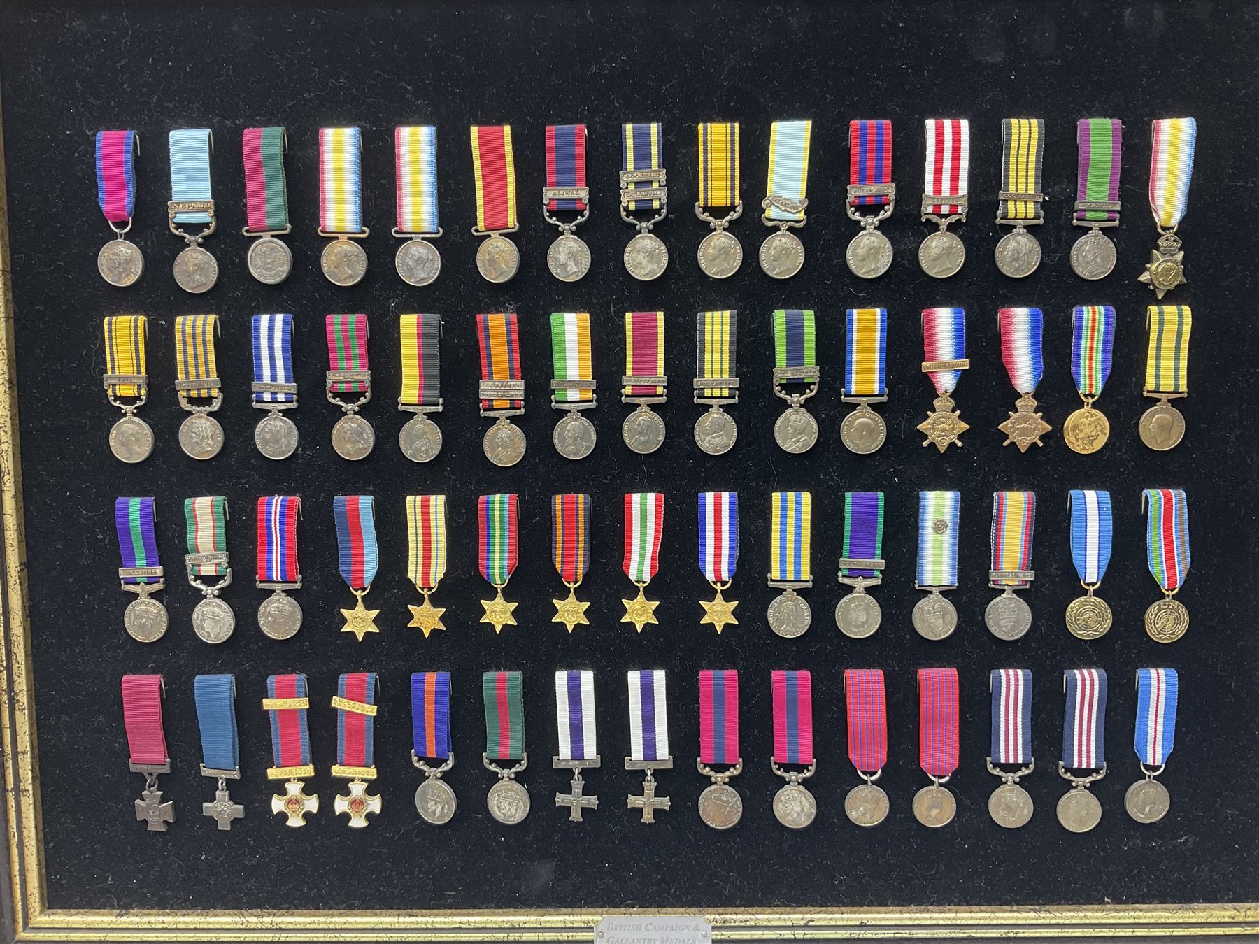 Two limited edition large framed display boards with half-size copies of British Gallantry and Campaign Medals produced by Danbury Mint and entitled 'For Valour'. Sixty medals on each board, all with ribbons. Complete with Danbury Mint certificate serial number A0148 and other paperwork.