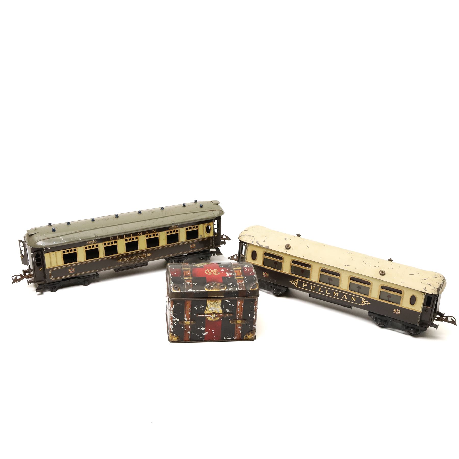 Hornby O gauge Parlour Car 'Grosvenor', a Hornby Pullman coach and a vintage Crumpsall biscuit tin in the form of a trunk