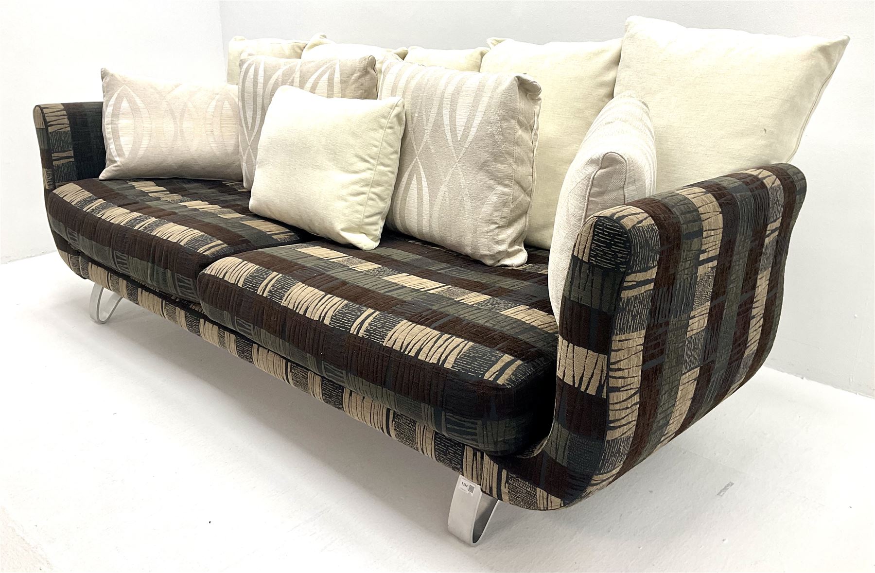 Grande four seat sofa upholstered in patterned fabric with contrasting scatter cushions 