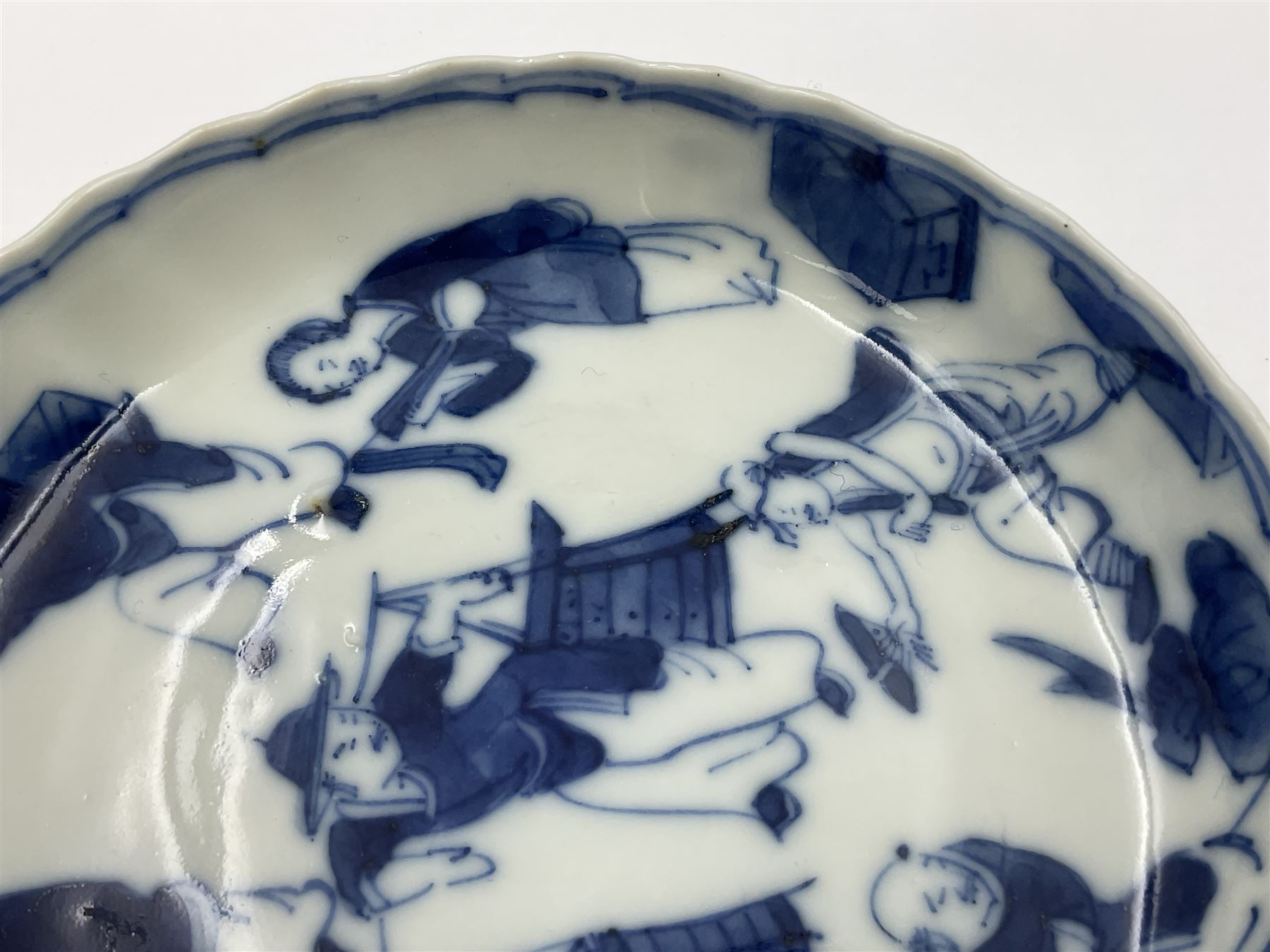 18th century Chinese blue and white Kangxi teacup and saucer, decorated with dancing figures, four character Kangxi mark beneath, saucer D10cm