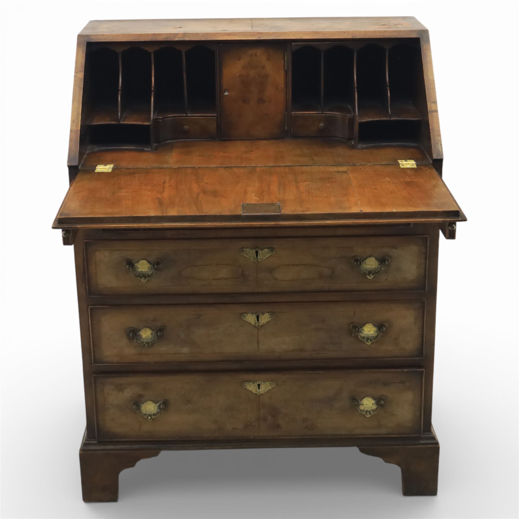 19th century walnut bureau of small proportions, the sloping fall enclosing a fitted interior with shaped pigeonholes and small drawers, above four long graduated drawers with feather banded walnut veneers, fitted with brass swan neck handles and escutcheons, raised on shaped bracket feet