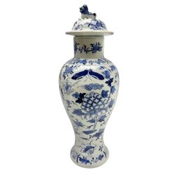 Chinese blue and white vase, decorated with flowers, birds and insects, foo dog finial to cover, with character marks beneath, H32cm 