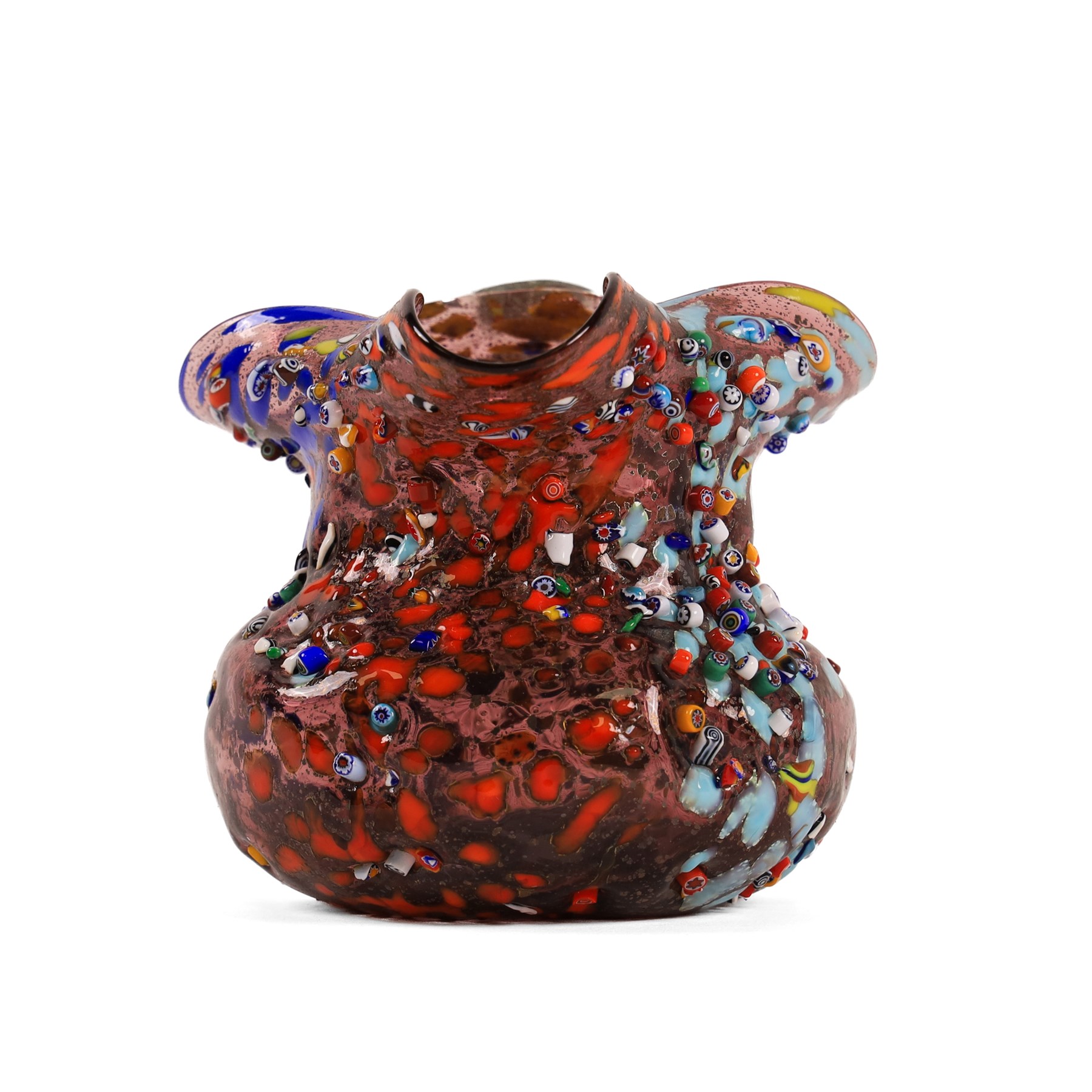 Two Murano Glass jugs by Zecchin, the fist decorated with millefiori design, upon a purple mottled ground, the other upon a green ground, H10cm