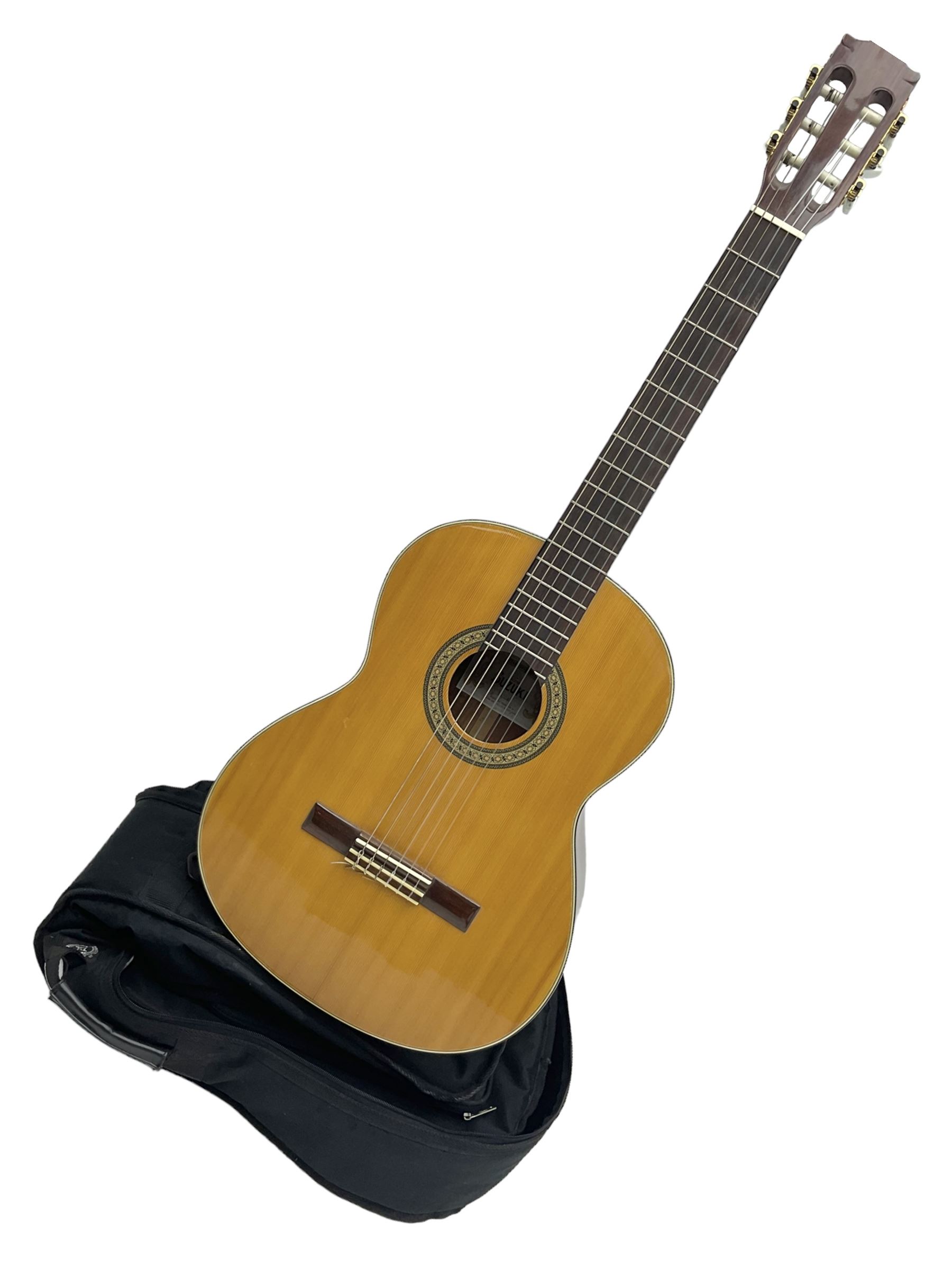 Nagoya Suzuki Model SC240 acoustic guitar with mahogany back and ribs and spruce top, bears label, L101cm; in soft carrying case