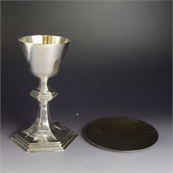 Mid 20th century silver chalice and paten, the chalice of plain tapering form, upon hexago...