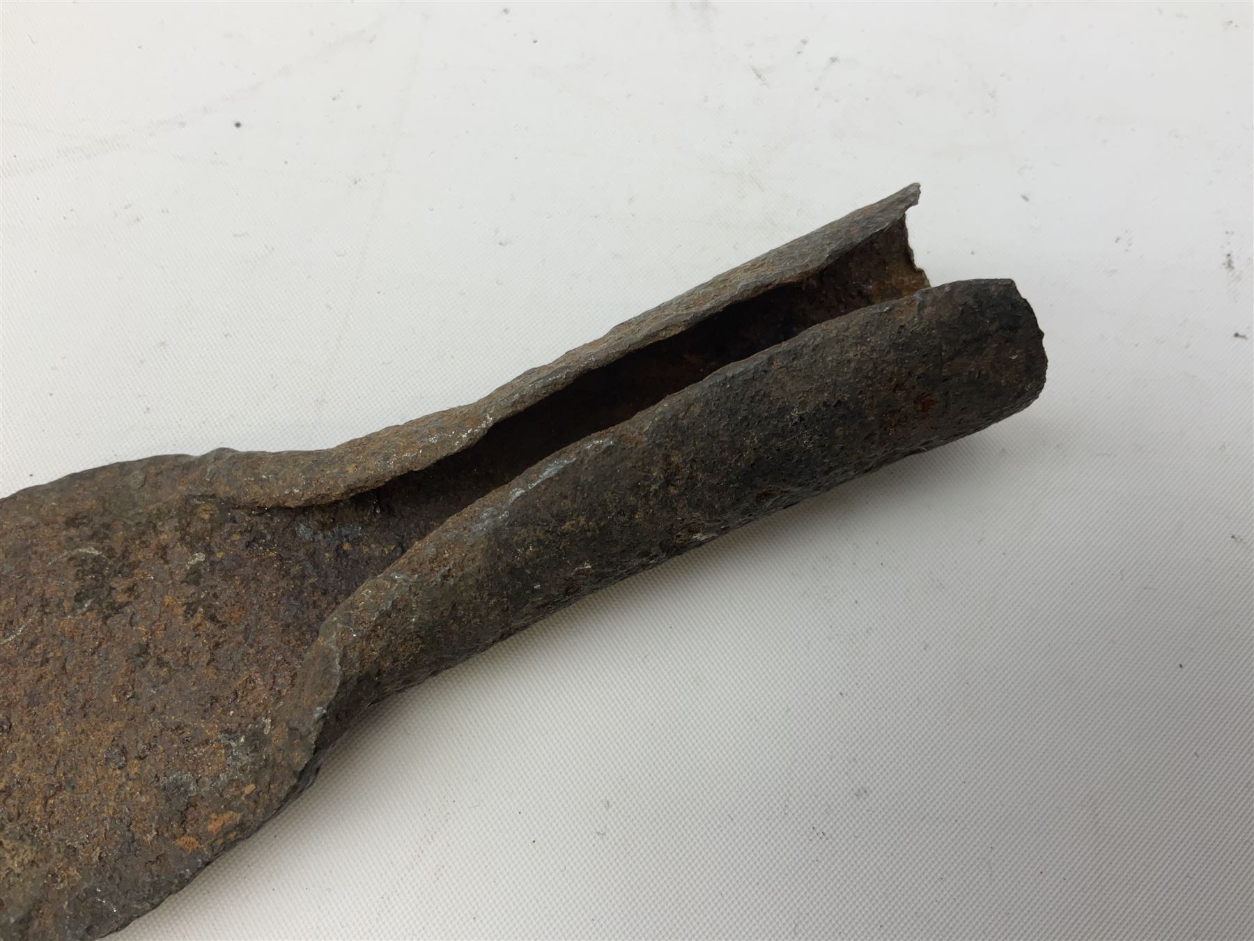 Patinated 'bronze' fantasy dagger, the 26cm blade, hilt and scabbard cast with dragons L50cm overall; hand forged iron spearhead L29.5cm; and a stiletto blade (3)