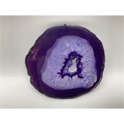 Pair of purple agate slices, polished with rough edges, raised upon gilt metal stands