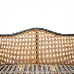 Early 20th century French bergère settee, the shaped caned back flanked by caned sides and scrolling arms, moulded beech frame with dark painted finish, serpentine seat rail with webbing, on cabriole legs with pad feet