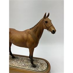 A Royal Worcester limited edition figure, Arkle, owned by the Duchess of Westminster, modelled by Doris Lindner, on wooden base, H27cm. 