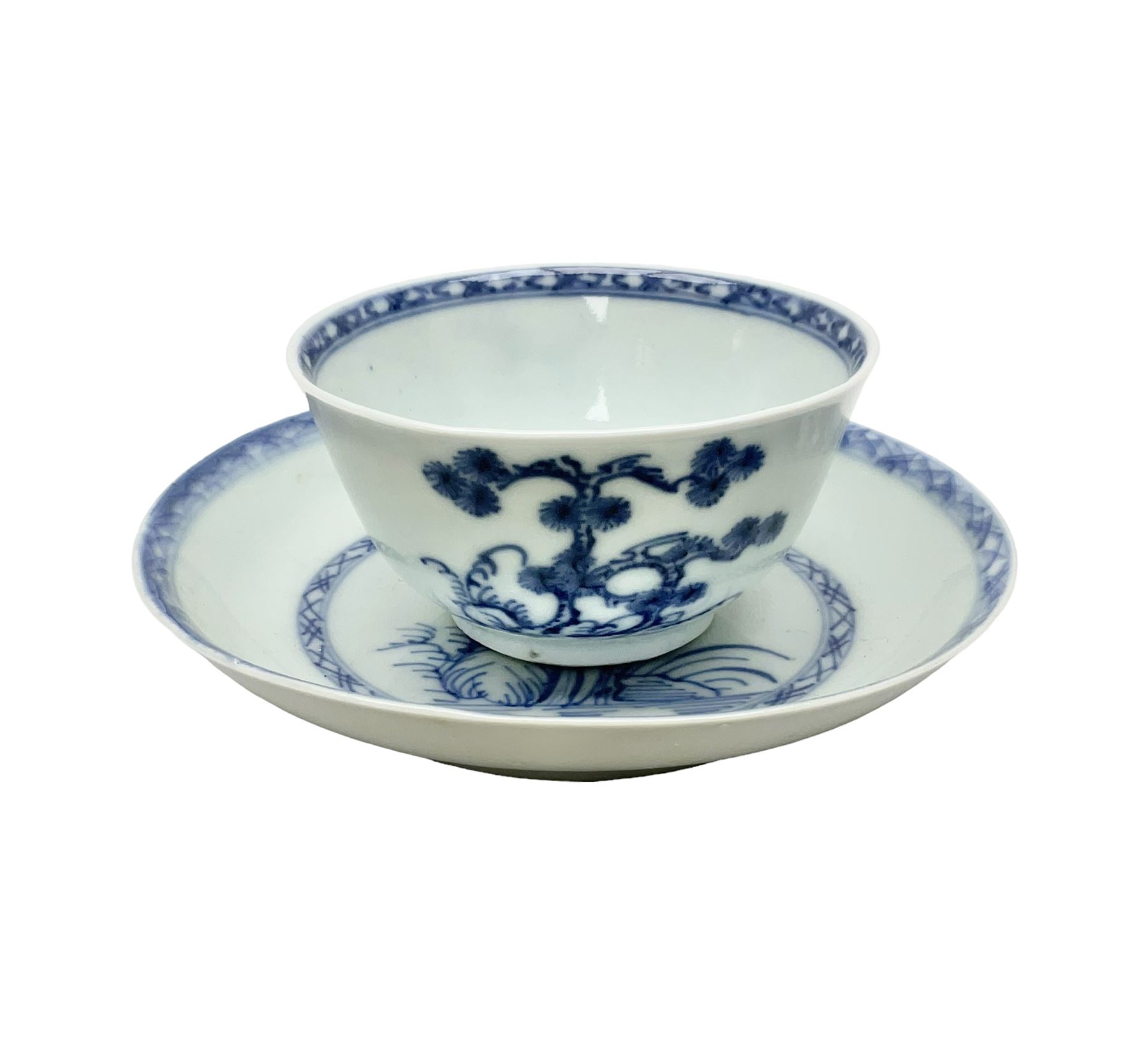 Chinese Nanking Cargo tea bowl and saucer, each decorated with pin tree, saucer with Christie's lot label beneath, tea bowl D7.5cm, saucer D11.5cm