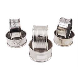 Six modern silver napkin rings, some with engraved initials, all hallmarked 