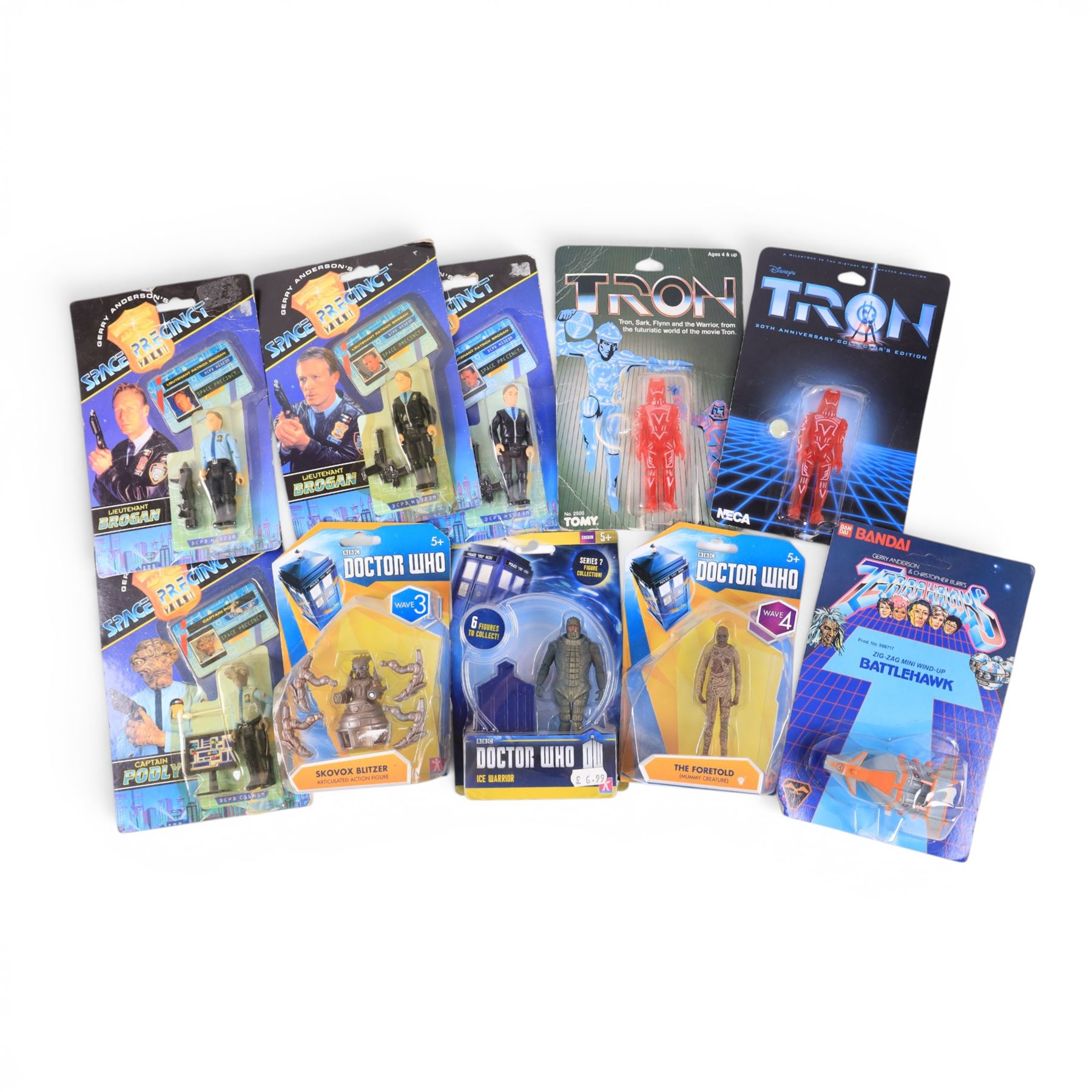 Nine TV & Film figures, comprising Neca 20th Anniversary Disney's Tron Sark, Tomy Disney's Tron Sark, four Gerry Anderson's Space Precinct Lieutenant Brogan and Captain Podly figures and Character Doctor Who Skovox Blitzer, Ice Warrior and The Foretold figures, together with a Bandai Terrahawks Zig-Zag Mini Wind Up Battlehawk, all carded