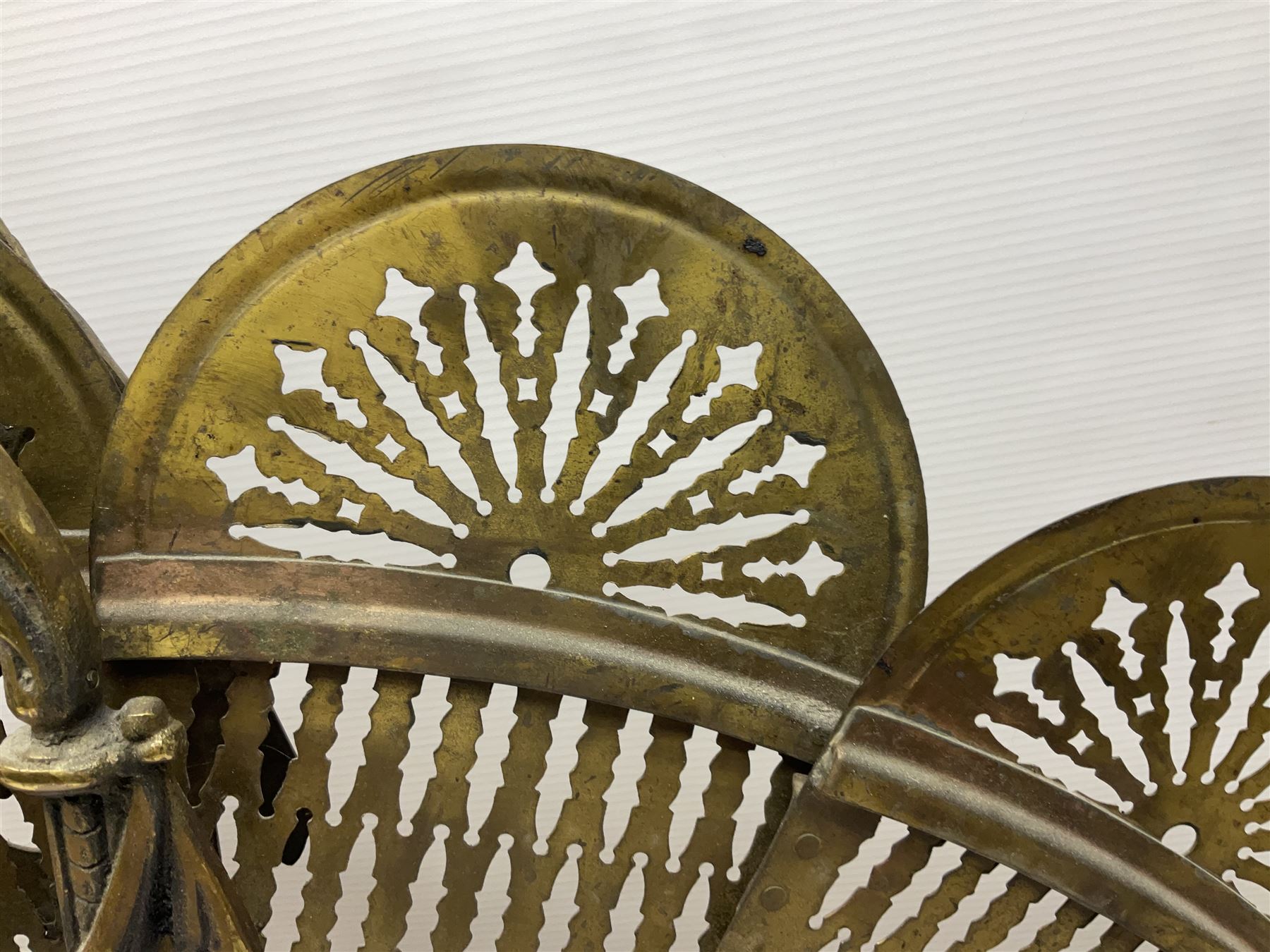 Pierced brass peacock style folding fire screen, with urn finial, H65.5cm