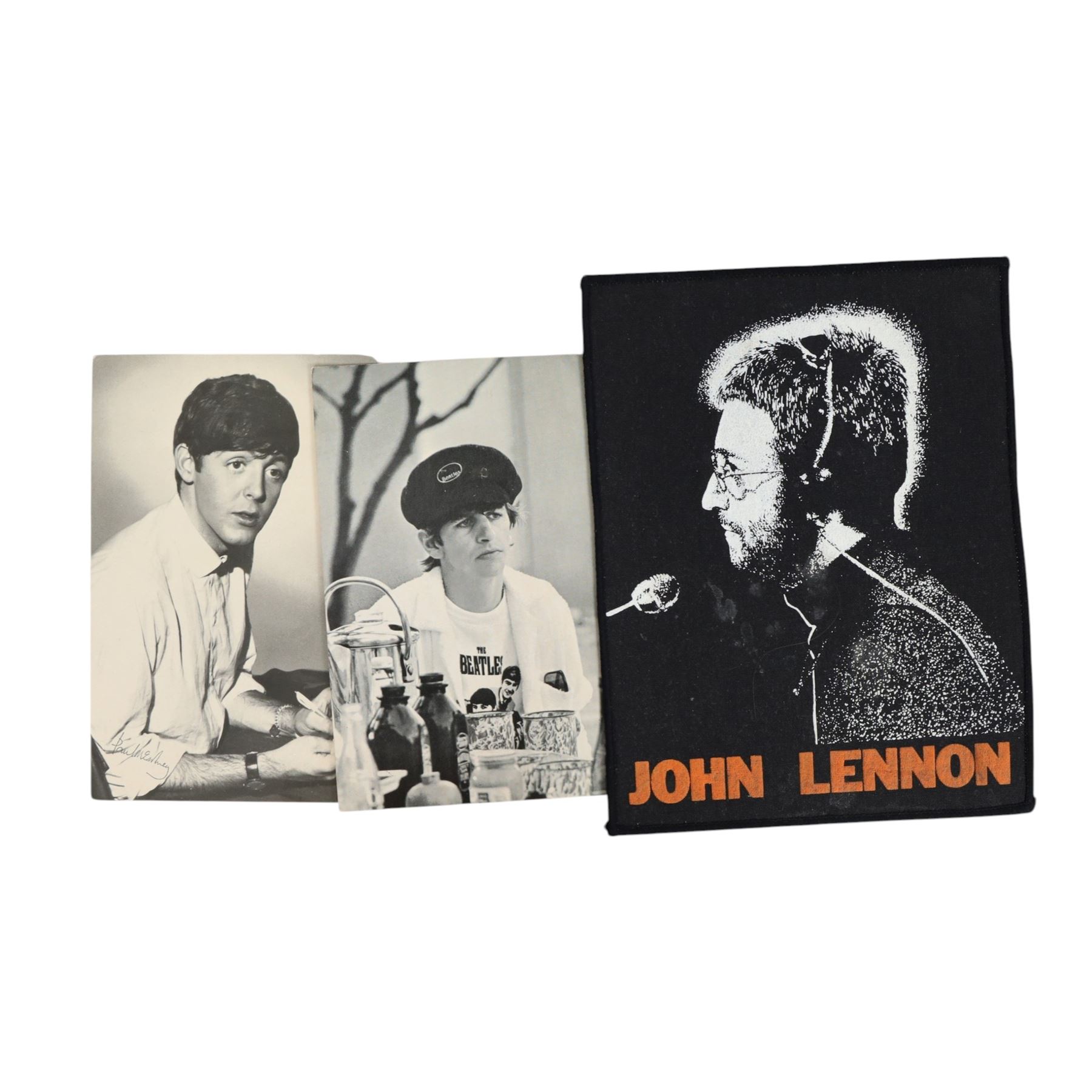 Beatles memorabilia, comprising John Lennon patch, nineteen Beatles chewing gum cards, collection of photographs and postcards including Eskimo Frozen Foods examples, two Beatles City carrier bags and Yellow Submarine cardboard cut-outs