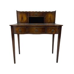 Mahogany writing desk, raised back fitted with two cupboards and drawer, serpentine top with leather inset over three drawers, square tapering supports