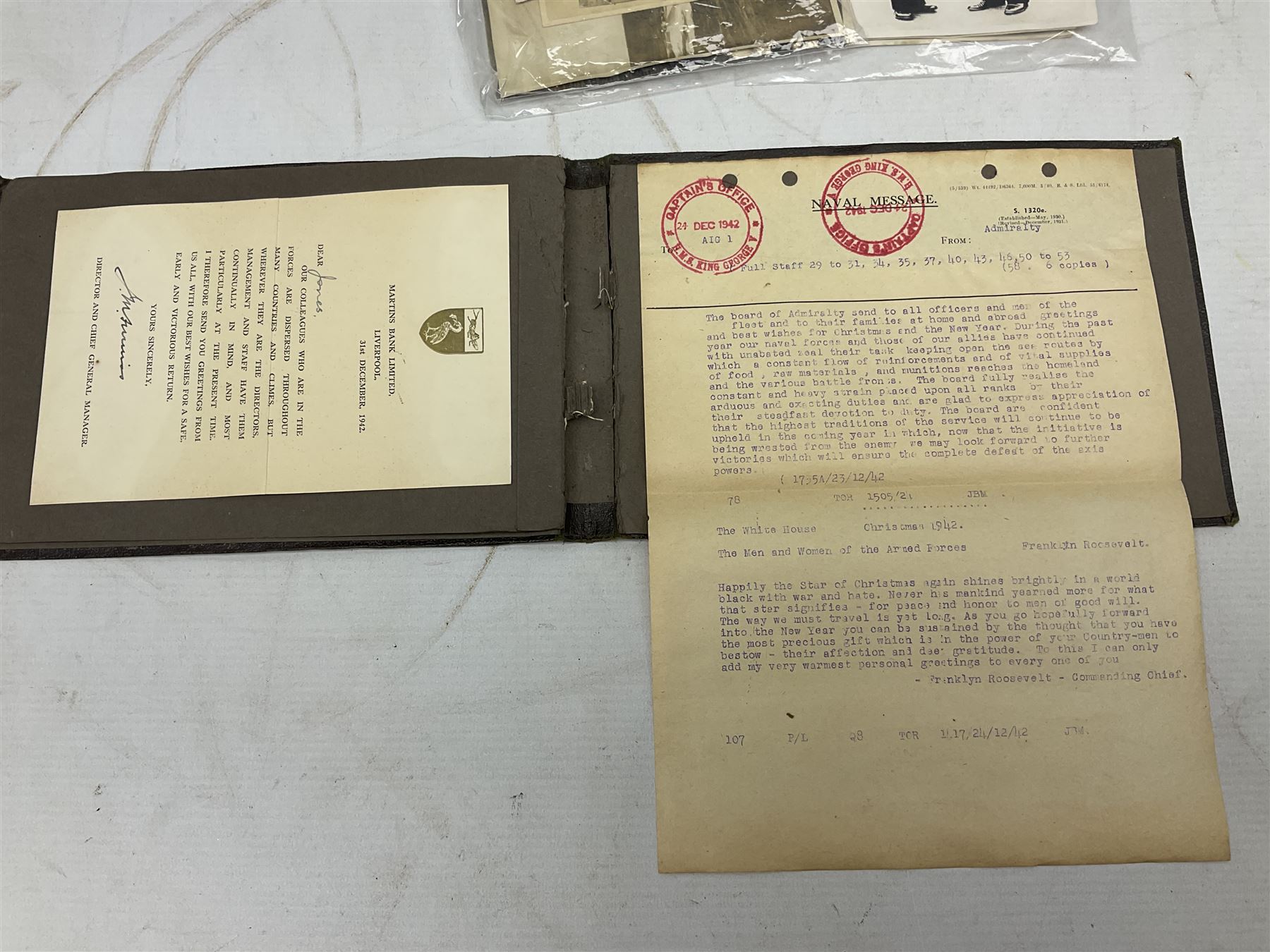 Disbound WW2 album relating to the battleship HMS King George VI containing over fifty various size loose photographs of the ship in action, guns firing, crew members, aircraft, two of George VI on board, three of Winston Churchill on board, official 1942 Christmas messages including Franklin Roosevelt etc; together with unrelated printed letter on 10 Downing Street notepaper from Winston Churchill; and Order of Service for Churchill's funeral at St. Paul's Cathedral 30th January 1965