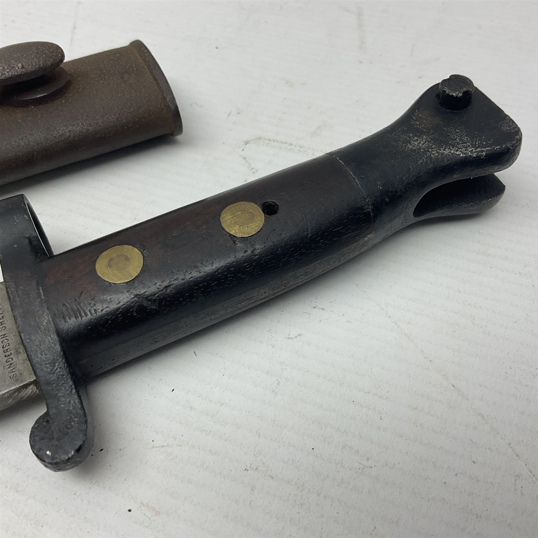 British Pattern 1888 knife bayonet, the 30cm double edged blade by Sanderson with central raised medial ridge and various marks to the ricasso including date code 12 98; in leather covered scabbard with various stamped marks L44cm overall