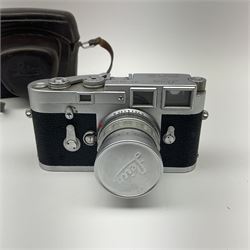 Leica M3 camera body, 1959, chrome finish, serial number '986937', fitted with 'Ernst Leitz GmbH Wetzlar Summicron f=5cm 1:2 Nr.1592614' lens, with Leica M3 instruction booklet