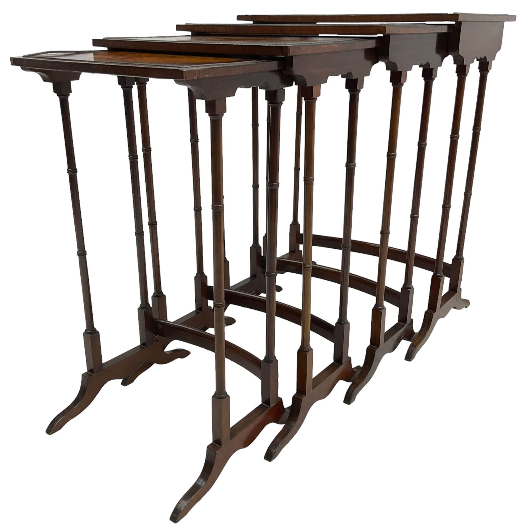 20th century inlaid mahogany quartetto nest of four tables, rectangular top inlaid with birdseye maple oval panel, ring turned supports on sledge feet