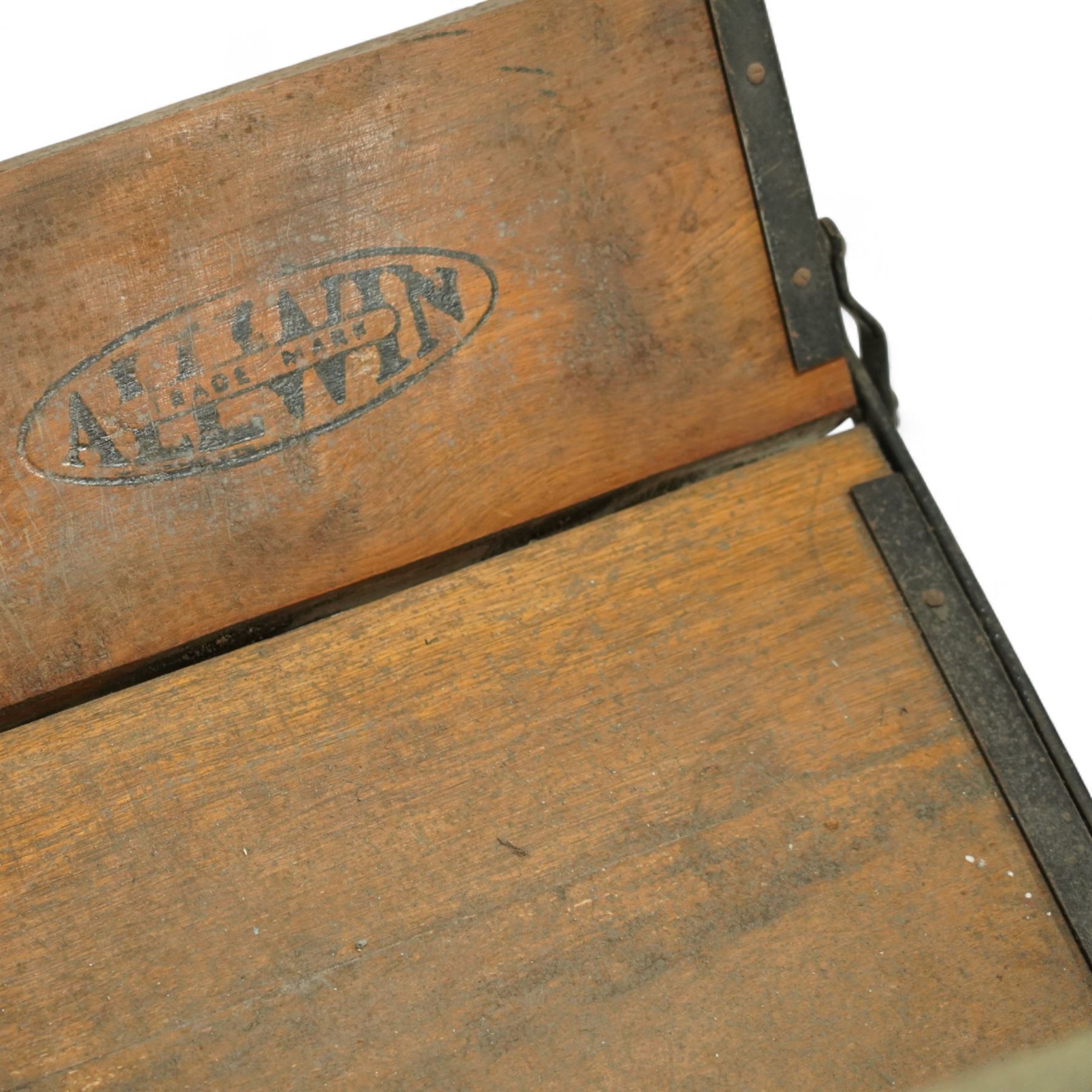 *Early 20th century invalid chair, the tubular metal frame with folding mechanism, canvas seat and back, padded armrests, raised on coil springs and large spoked wheels with wooden footrestFrom the Kirkham Hall Attic & Cellar Collection, sold without reserve