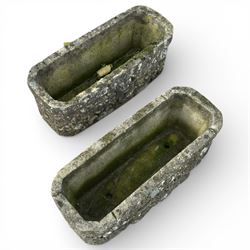 Two cast stone planters / troughs with lion emblems