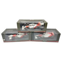 Three Paul's Model Art 1:18 scale die-cast McLaren racing cars - Mercedes MP4/11 D. Coulthard; MP4/4 A. Prost; and Mercedes MP4/10 M. Hakkinen; all boxed (3)