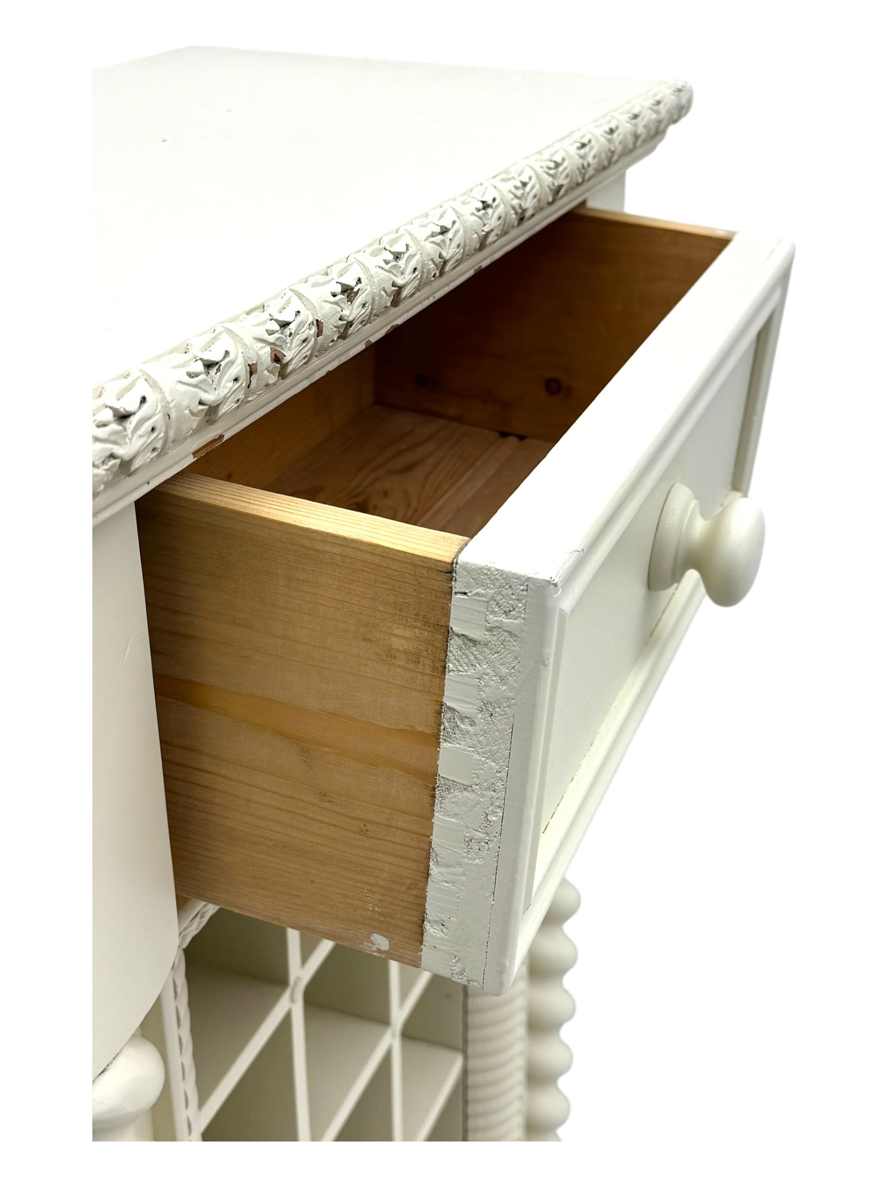 Contemporary painted wooden wine cabinet, rectangular form with carved leaf moulded cornice over single drawer and fifteen bottle compartments, flanked by spiral twist pilasters; together with a cream painted and chrome lantern, with glazed sides and leather handle (2)