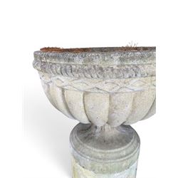 Four 20th century good quality weathered cast stone pedestal urns, circular lobed bowls with rope twist and lattice border, raised on squat base with fluted columns