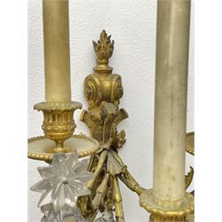 19th century ormolu wall sconce, the shaped and scroll back with flambeau finial supporting five curved branches with acanthus detail and cut glass drops, leading to part fluted sockets and beaded dip pans, H32cm