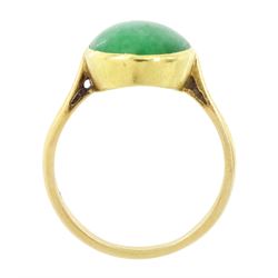 Early - mid 20th century gold jade ring, bezel set with a single oval cabochon jade of approx 4.10 carat, stamped 18ct