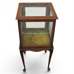 Edwardian bijouterie two tier table, glazed top and sides with inlay surround, glazed door enclosing a single shelf and baized lined interior, raised on cabriole supports