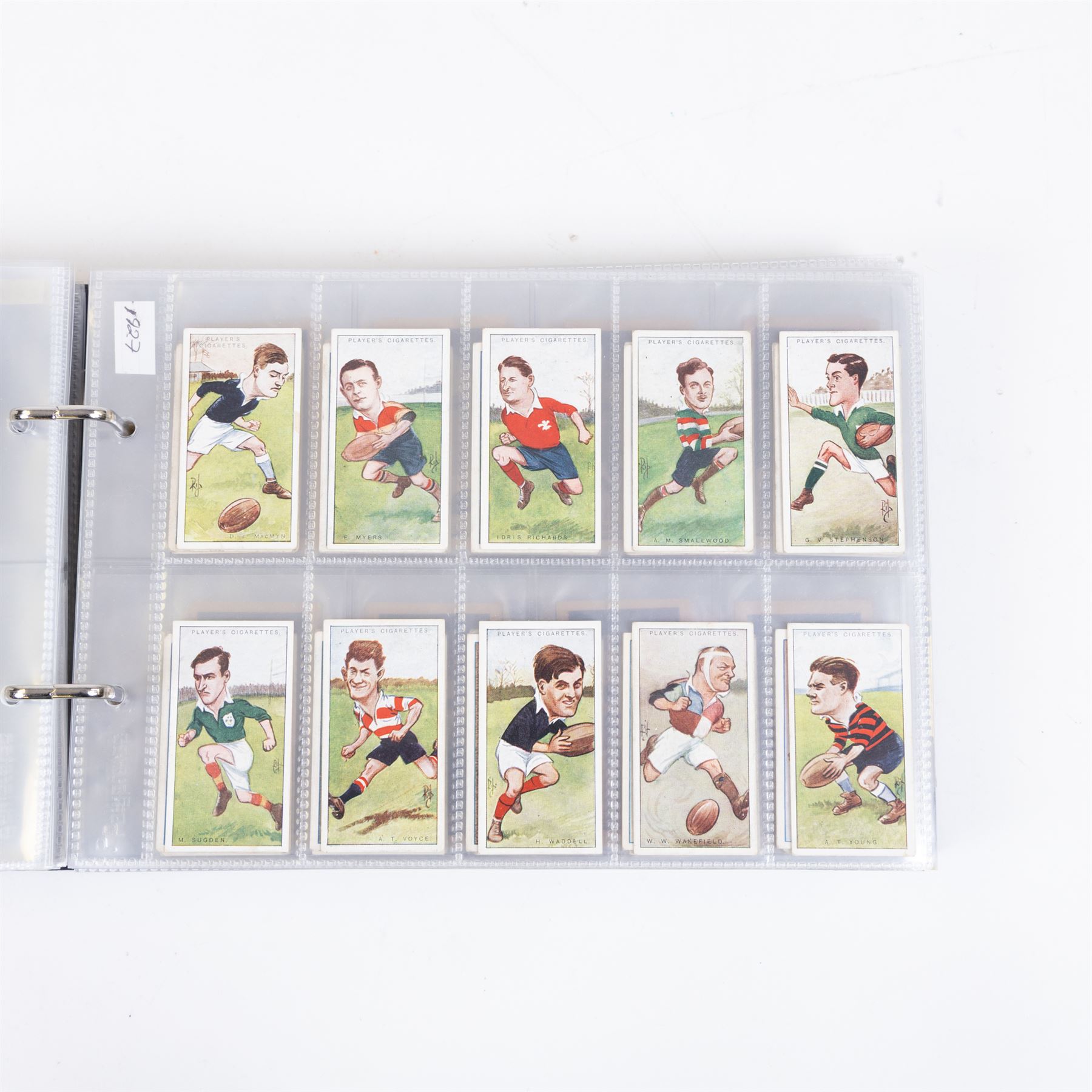 Collection of Edwardian and later Football related trading and cigarette cards, including forty-nine of fifty 1906 Ogden's Football Club Colours, 1922 PALS Footall series, ninety of one hundred 1925 Gallaher Famous Footballers, complete set of forty-four 1926 Ogden's Captains of Association Football Clubs and Colours, complete set of fifty 1927 Players Football Caricatures by MAC,  complete set of fifty 1927 Players Football Caricatures by RIP,  complete set of fifty 1930 Players Association Cup Winners, complete set of 50 1933 Ogdens AFC Nicknames etc, housed in brown cigarette card album