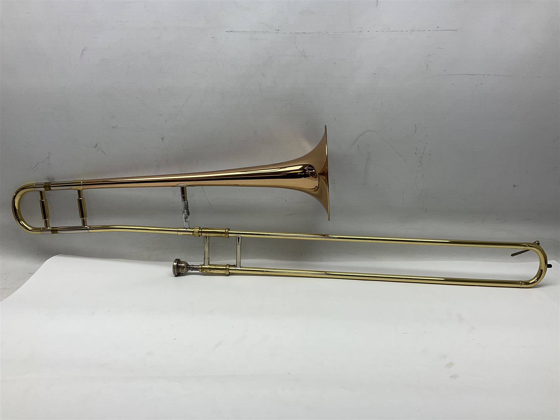 Sebastian Bucklet Aquae Sulis copper and brass trombone No.0910004; in lightweight carrying case; and Kinsman folding tubular chrome music stand in case (2)
