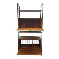 Staples Ladderax - mid-20th century teak and metal framed modular wall unit, fitted with central fall-front cupboard enclosing correspondence dividers, over secondary separate teak fall-front cupboard, adjustable shelf to top