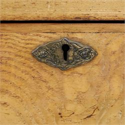 Edwardian Neoclassical figured ash and inlaid double combination wardrobe, the left section with mirrored door enclosing a hanging rail, the right section with cupboard door above four graduated drawers with glass knobs, raised on castors
