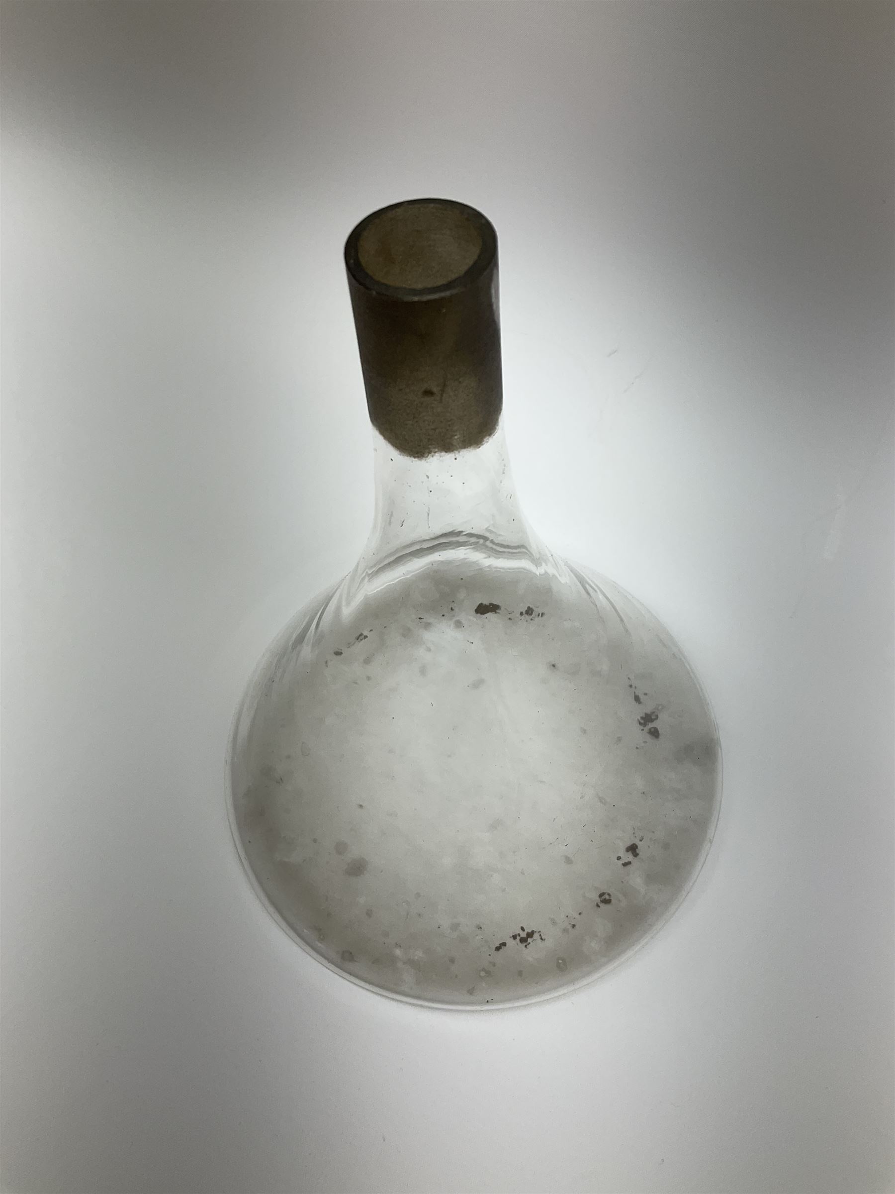 Collection of 19th century and later pharmaceutical laboratory glass, to include, large filter funnel, graham condenser, conical flask, bell jar and another with graduated tube, Provenance: discovered in the storeroom of a long established Hull pharmacist and opticians