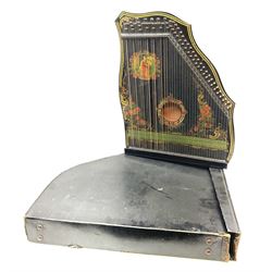 Late 19th/early 20th century zither of typical ebonised form decorated with a panel of a lady playing a harp, flowers etc L54cm, cased