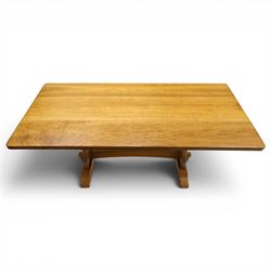 Knightman - oak refectory dining table, the rectangular adzed top raised on shaped trestle supports joined by central stretcher, with recessed carved knight trademark, by Horace Knight of Old Mill Furniture, Balk near Thirsk