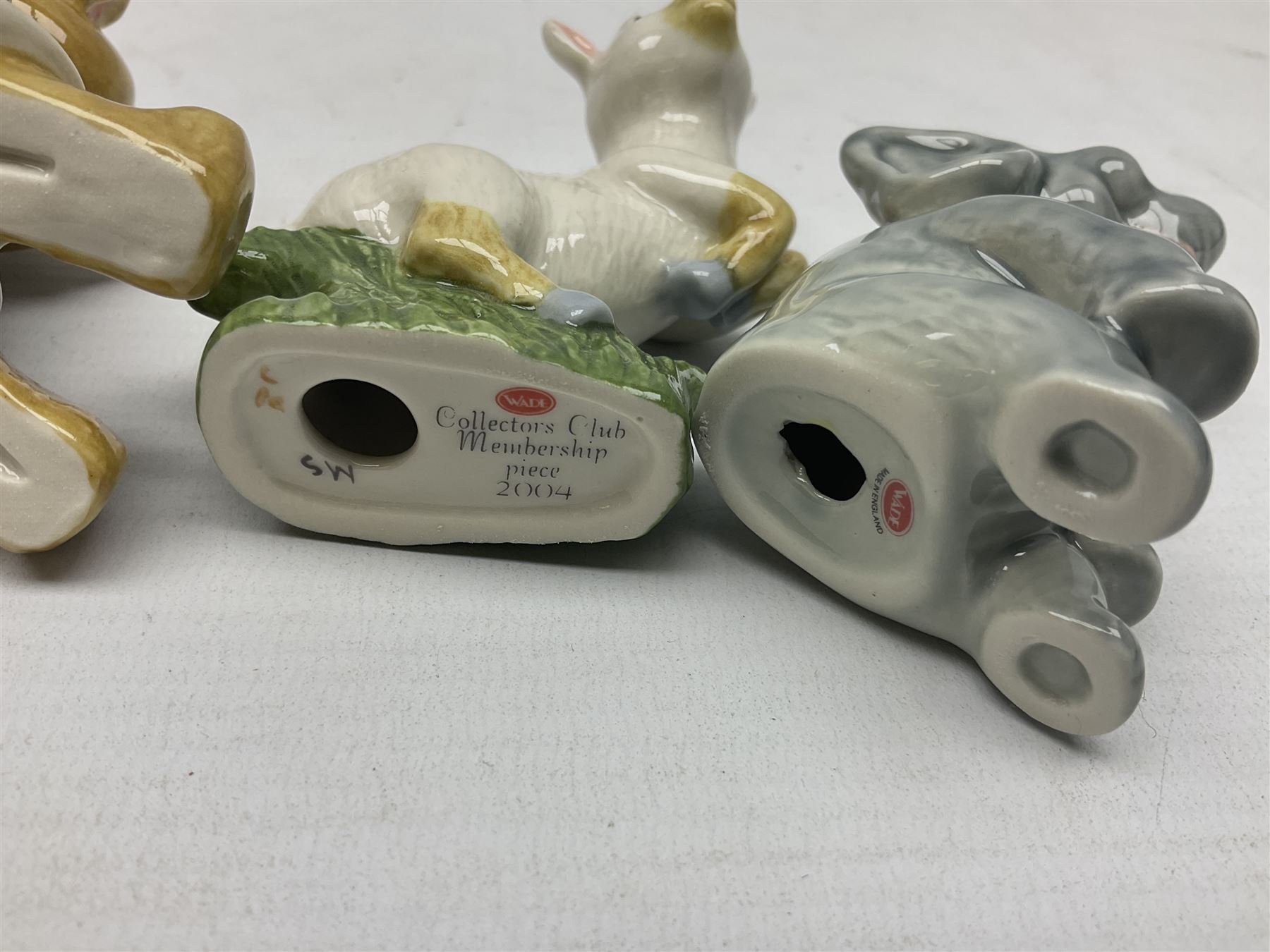 Nine Wade Collectables figures, comprising six Myths and Legends; King Canute, Mermaid, St George, Cornish Tin Mine Pixie, Puck and Green man, together with Lamb, Elephant and bear, a Wade Panda money box and two boxes of Wade Christmas Crackers