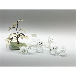 Collection of Swarovski small animals, comprising goat, rabbit, cat, bear and fox, along with an owl and a decorative tree. 