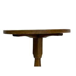 Gnomeman - oak coffee table, circular top with guilloche carved band, on square chamfered pillar support carved with gnome signature and cruciform base, by Thomas Whittaker, Littlebeck
