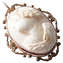 Early 20th century cameo brooch carved as a female bust, in ornate rose gold mount 