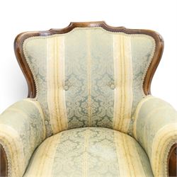 Edwardian mahogany three-piece salon suite, comprising settee and two armchairs, shaped frames with upholstered backs, scrolled arm supports and serpentine seat rails, upholstered in striped floral damask fabric, on cabriole supports with castors (Armchairs: H 96cm, W 70cm, D 68cm)