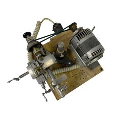 Lorch 6mm watchmakers lathe with tailstock, crosslide, tool rest, four-way tool post, pulleys and motor. Mounted on a wooden board.