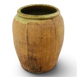 Large Continental terracotta olive jar, of typical baluster form with a green glaze band d...