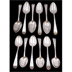 Two sets of six George III silver teaspoons, both with bright cut decoration and engraved initials, the first set hallmarked John Lambe, London 1785 and the second set hallmarked Duncan Urquhart & Naphtali Hart, London 1805