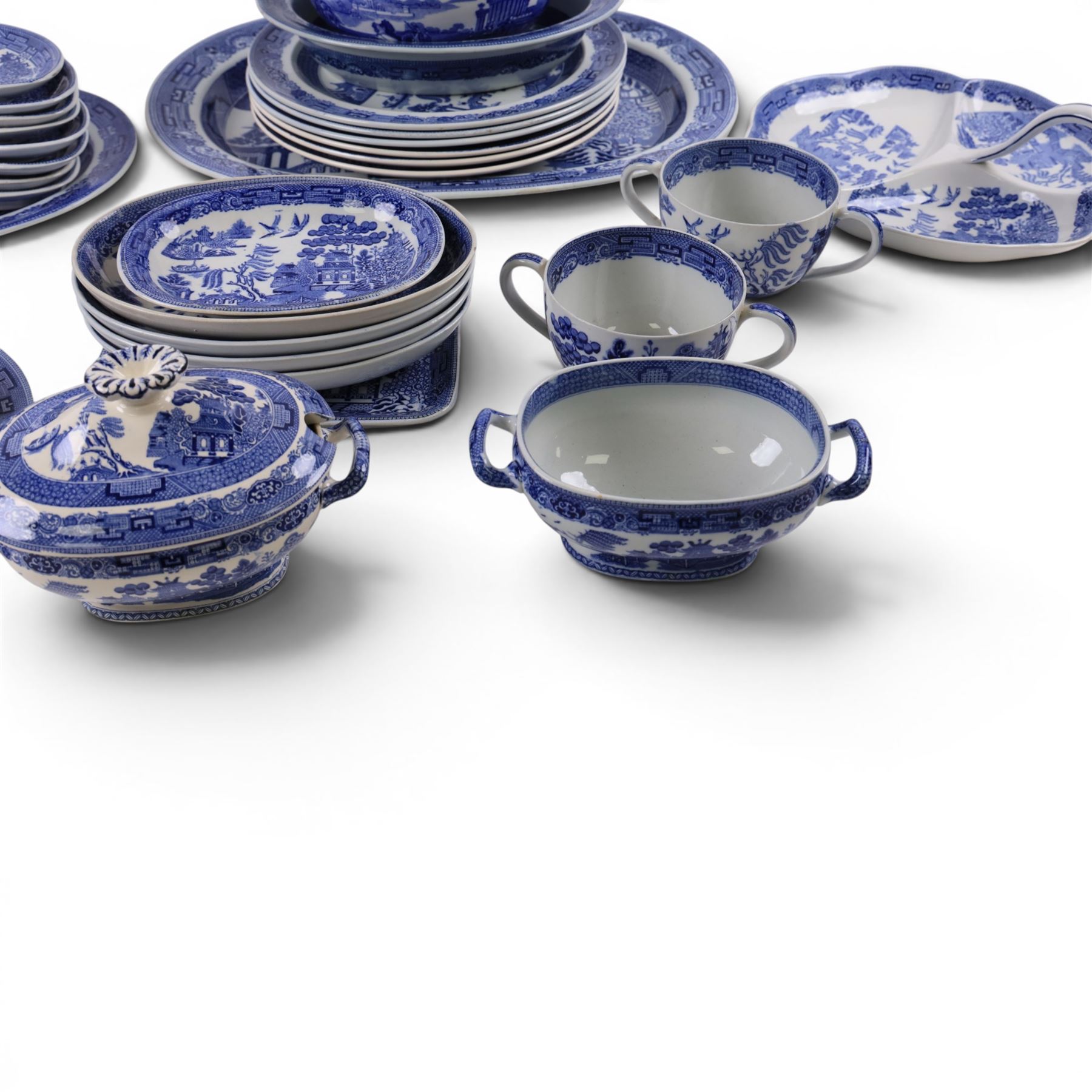 Collection of blue and white dinner wares, mainly Wedgwood Willow pattern, including serving platter, dinner plates etc   